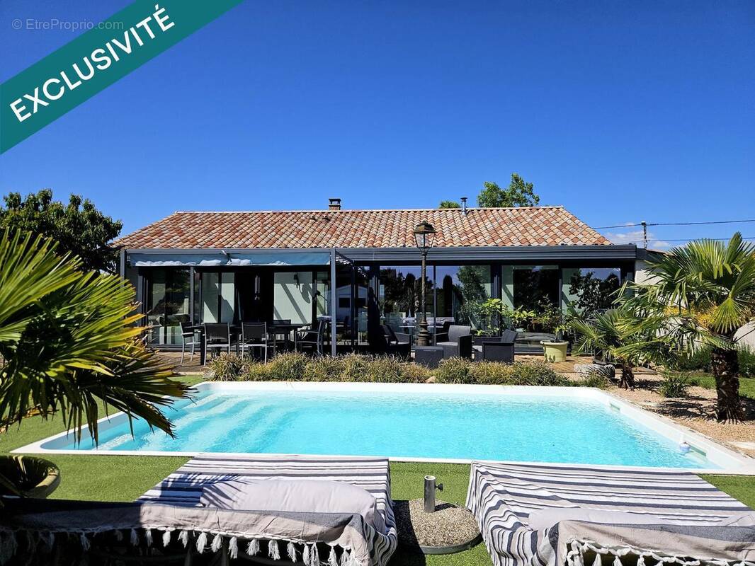 Photo 1 - Maison à JASSANS-RIOTTIER
