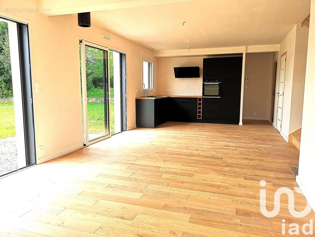 Photo 1 - Maison à PLUGUFFAN